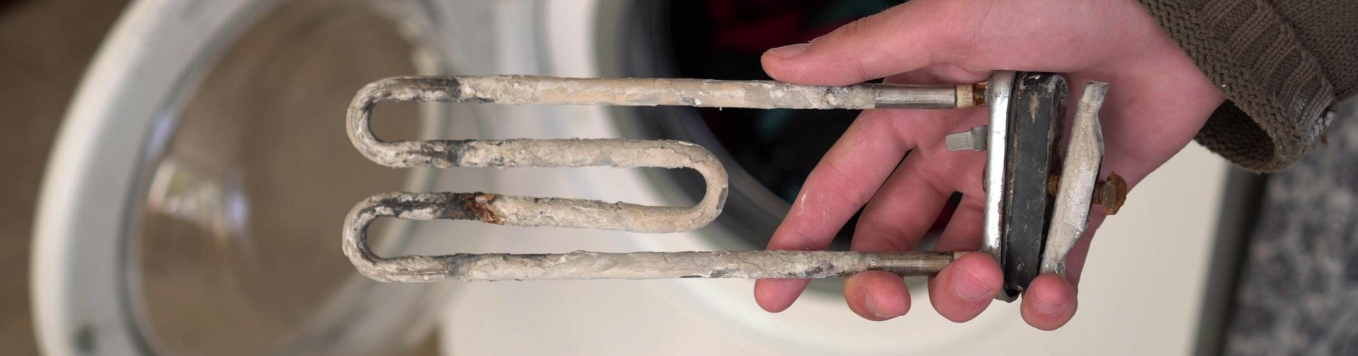 Dépôt de tarte sur une résistance de lave-linge